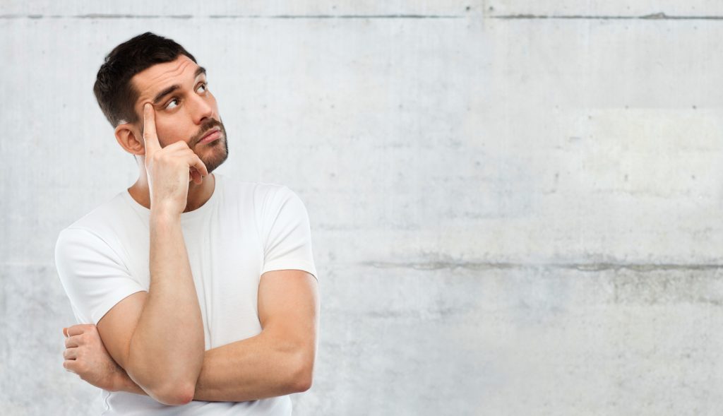 man thinking over gray background